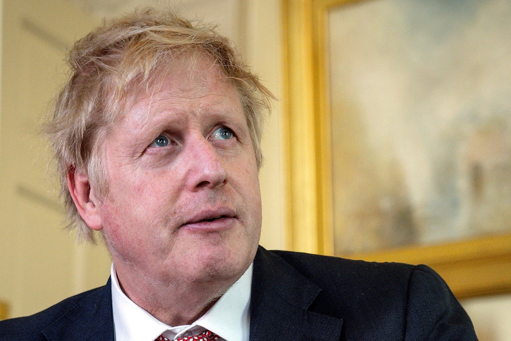 A handout image released by 10 Downing Street, shows Britain's Prime Minister Boris Johnson as he delivers a television address after returning to 10 Downing Street after being discharged from St Thomas' Hospital, in central London on April 12, 2020. - British Prime Minister Boris Johnson was discharged from hospital on Sunday, a Downing Street spokesman said, a week after being admitted for treatment for coronavirus and spending three days in intensive care. 